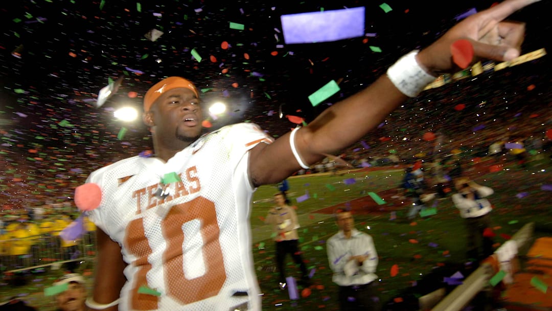 Jan 4, 2006; Pasadena, CA, USA; Texas Longhorns quarterback (10) Vince Young celebrates after defeating the Southern California Trojans 41-38 in the Rose Bowl Game at the Rose Bowl in Pasadena, California. Mandatory Credit: Mark J. Rebilas-Imagn Images Copyright © 2006 Mark J. Rebilas