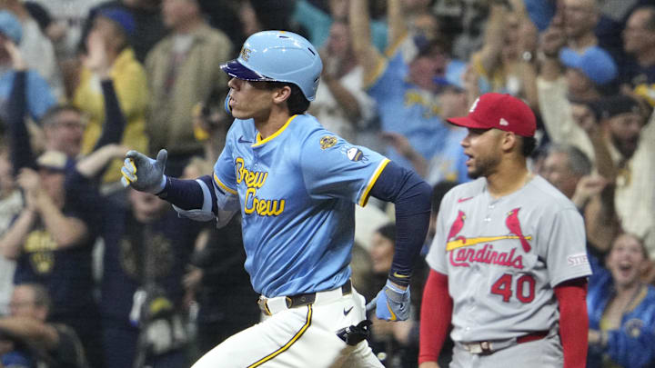 Sep 12, 2025; Milwaukee, Wisconsin, USA; Milwaukee Brewers outfielder Christian Yelich (22) hits a home run against the St. Louis Cardinals in the seventh inning at American Family Field. Mandatory Credit: Michael McLoone-Imagn Images