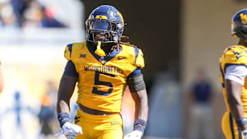 Aug 30, 2025; Morgantown, West Virginia, USA; West Virginia Mountaineers safety Fred Perry (5) celebrates after a tackle for loss during the second quarter against the Robert Morris Colonials at Milan Puskar Stadium. Mandatory Credit: Ben Queen-Imagn Images