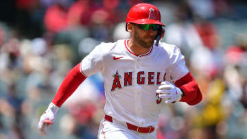 May 1, 2024; Anaheim, California, USA; Los Angeles Angels outfielder Taylor Ward (3) reaches first on a wild pitch by Philadelphia Phillies pitcher Zack Wheeler (45) during the first inning at Angel Stadium. Mandatory Credit: Gary A. Vasquez-USA TODAY Sports