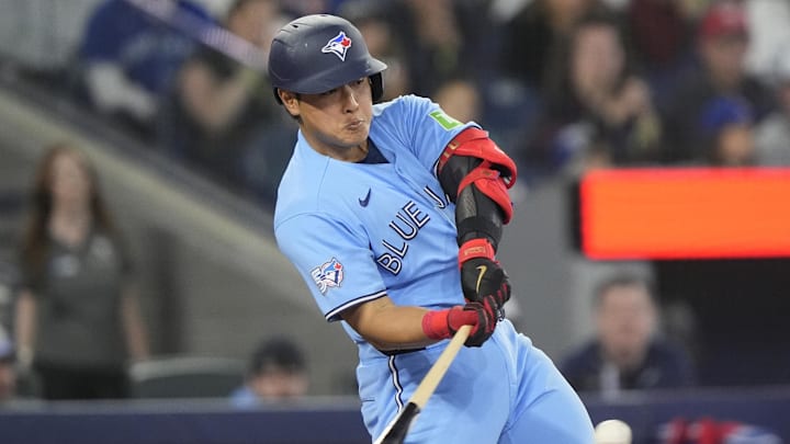 Apr 29, 2026; Toronto, Ontario, CAN; Toronto Blue Jays third baseman Kazuma Okamoto (7) hits a one run single against the Boston Red Sox during the third inning at Rogers Centre. Mandatory Credit: John E. Sokolowski-Imagn Images