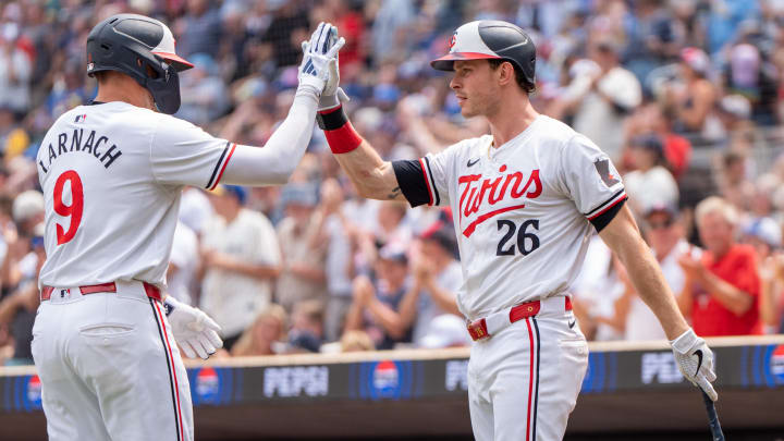 Jul 21, 2024; Minneapolis, Minnesota, USA; Minnesota Twins designated hitter Trevor Larnach (9) is congratulated by Minnesota Twins right field Max Kepler (26) after hitting a two run home run in the fifth inning at Target Field. Mandatory Credit: Matt Blewett-USA TODAY Sports