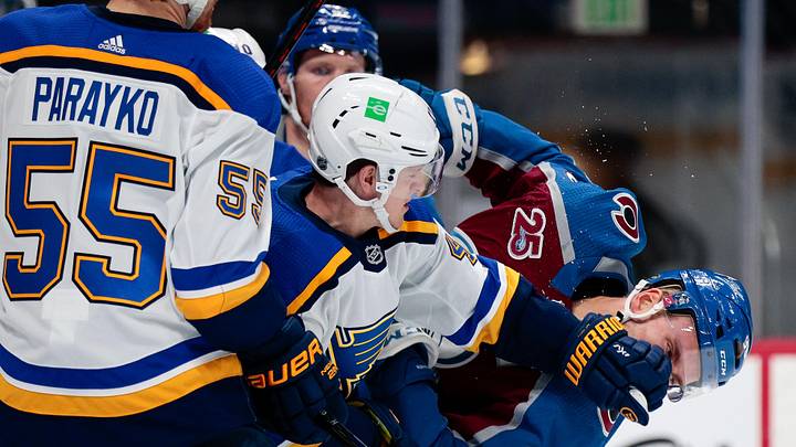 Jan 13, 2021; Denver, Colorado, USA; St. Louis Blues defenseman Torey Krug (47) pushes Colorado Avalanche right wing Mikko Rantanen (96) as defenseman Colton Parayko (55) looks on in the third period at Ball Arena. Mandatory Credit: Isaiah J. Downing-Imagn Images