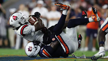 Sep 6, 2025; Auburn, Alabama, USA;  Ball State Cardinals wide receiver Eric Weatherly (3) is tackled by Auburn Tigers safety Sylvester Smith (19) during the second quarter at Jordan-Hare Stadium. Mandatory Credit: John Reed-Imagn Images