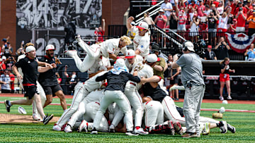 Louisville baseball players celebrate after defeating Miami in game three of the 2025 Louisville Super Regional.