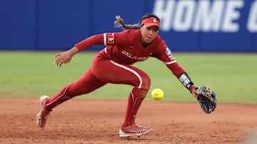 Oklahoma shortstop Tiare Jennings (23) chases after the ball in the third inning during Game 2 of the NCAA softball Women's College World Series Championship Series game.