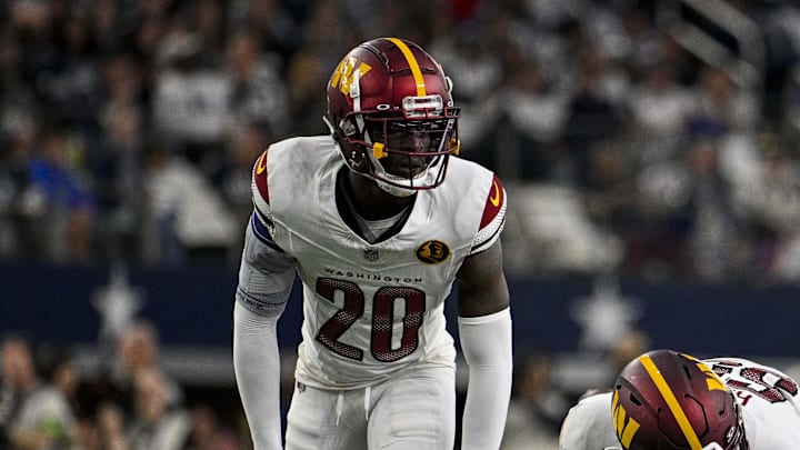 Nov 23, 2023; Arlington, Texas, USA; Washington Commanders safety Jartavius Martin (20) and defensive end KJ Henry (55) in action during the game between the Dallas Cowboys and the Washington Commanders at AT&T Stadium. Mandatory Credit: Jerome Miron-Imagn Images