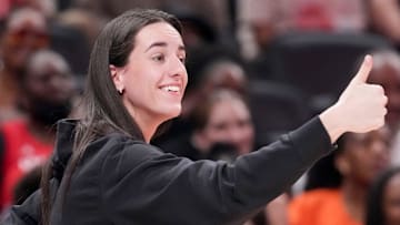 Indiana Fever's Caitlin Clark (22) gives a thumbs up to Los Angeles Sparks's Kelsey Plum (10) after she travels with the ball Saturday, July 19, 2025, during the WNBA All-Star Game at Gainbridge Fieldhouse in Indianapolis.
