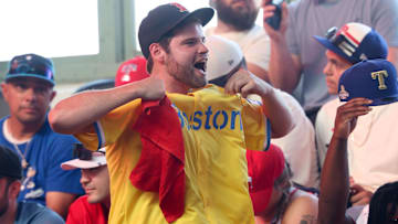 A Boston Red Sox fan reacts during the first round of the MLB Draft at Cowtown Coliseum.