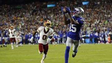 Nov 2, 2025; Landover, Maryland, USA;  Seattle Seahawks wide receiver Tory Horton (15) catches a touchdown pass as Washington Commanders cornerback Mike Sainristil (0) watches during the second quarter at Northwest Stadium. Mandatory Credit: Geoff Burke-Imagn Images