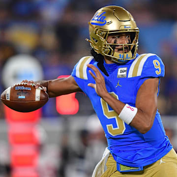 Nov 8, 2025; Pasadena, California, USA; UCLA Bruins quarterback Nico Iamaleava (9) throws against the Nebraska Cornhuskers during the first half at the Rose Bowl. Mandatory Credit: Gary A. Vasquez-Imagn Images