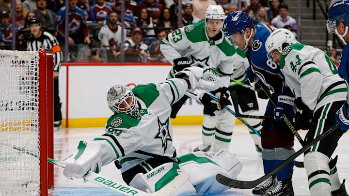 Apr 23, 2025; Denver, Colorado, USA; Dallas Stars goaltender Jake Oettinger (29) makes a save as Colorado Avalanche left wing Artturi Lehkonen (62) and defenseman Cody Ceci (44) and defenseman Esa Lindell (23) look on in the second period in game three of the first round of the 2025 Stanley Cup Playoffs at Ball Arena. Mandatory Credit: Isaiah J. Downing-Imagn Images