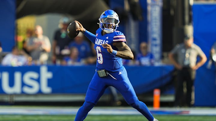Aug 23, 2025; Lawrence, Kansas, USA; Kansas Jayhawks quarterback Jalon Daniels (6) throws a pass during the first half against the Fresno State Bulldogs at David Booth Kansas Memorial Stadium. Mandatory Credit: Jay Biggerstaff-Imagn Images