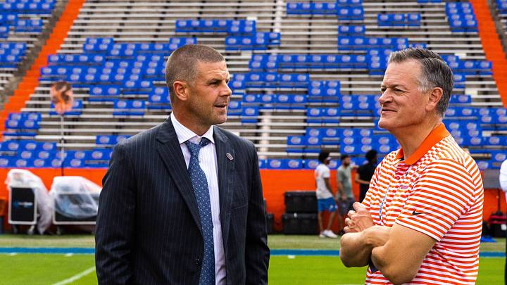 Florida Gators head coach Billy Napier shares a laugh with Florida Athletic Director Scott Stricklin on the field during Gator Walk at Steve Spurrier Field at Ben Hill Griffin Stadium in Gainesville, FL on Saturday, September 17, 2022. [Cyndi Chambers/Gainesville Sun]

Ncaa Football Florida Gators Vs Usf Bulls