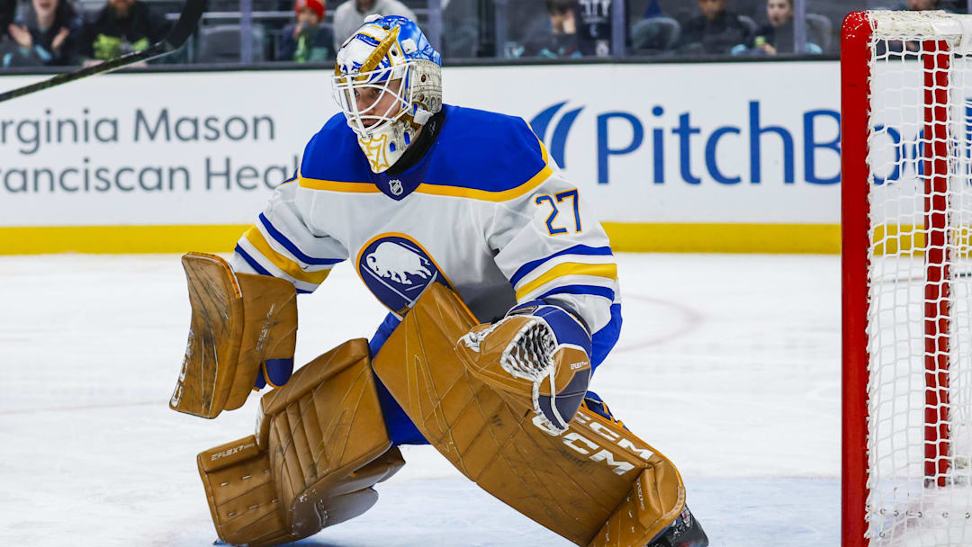 Jan 20, 2025; Seattle, Washington, USA; Buffalo Sabres goaltender Devon Levi (27) defends the net without a stick against the Seattle Kraken during the third period at Climate Pledge Arena. Mandatory Credit: Joe Nicholson-Imagn Images
