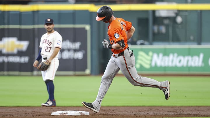 Jun 22, 2024; Houston, Texas, USA; Houston Astros second baseman Jose Altuve (27) looks on and Baltimore Orioles second baseman Jordan Westburg (11) rounds the bases after hitting a home run during the second inning at Minute Maid Park. Mandatory Credit: Troy Taormina-USA TODAY Sports