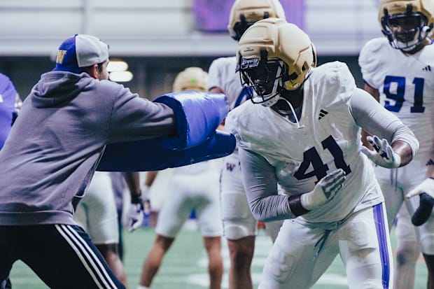 Deshawn Lynch goes through an edge-rusher drill in UW spring practice. 