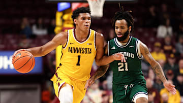 Nov 18, 2025; Minneapolis, Minnesota, USA; Minnesota Golden Gophers guard Isaac Asuma (1) works around Chicago State Cougars guard Braelon Bush (21) during the first half at Williams Arena. Mandatory Credit: Matt Krohn-Imagn Images