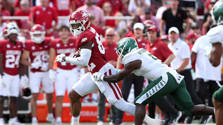 Sep 14, 2024; Fayetteville, Arkansas, USA; Arkansas Razorbacks wide receiver Monte Harrison (82) runs after picking up an onside kick in the first half against the UAB Blazers at Donald W. Reynolds Razorback Stadium. Mandatory Credit: Nelson Chenault-Imagn Images