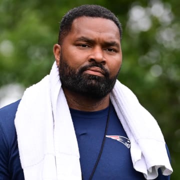 Jul 24, 2024; Foxborough, MA, USA;  New England Patriots head coach Jerod Mayo walks to the podium for a press conference before training camp at Gillette Stadium. Mandatory Credit: Eric Canha-USA TODAY Sports