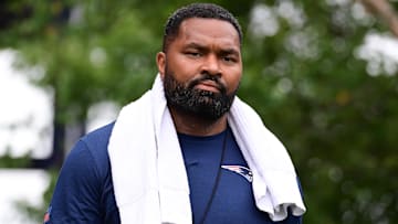 Jul 24, 2024; Foxborough, MA, USA;  New England Patriots head coach Jerod Mayo walks to the podium for a press conference before training camp at Gillette Stadium. Mandatory Credit: Eric Canha-Imagn Images