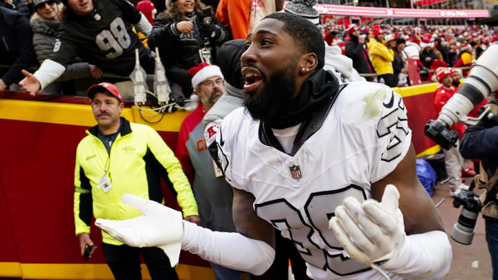 Dec 25, 2023; Kansas City, Missouri, USA; Las Vegas Raiders cornerback Nate Hobbs (39) interacts with the crowd after defeating the Kansas City Chiefs at GEHA Field at Arrowhead Stadium. Mandatory Credit: Jay Biggerstaff-USA TODAY Sports