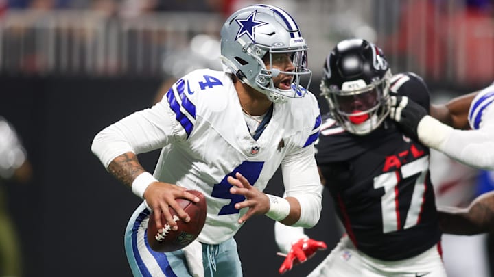 Nov 3, 2024; Atlanta, Georgia, USA; Dallas Cowboys quarterback Dak Prescott (4) scrambles against the Atlanta Falcons in the first quarter at Mercedes-Benz Stadium. Mandatory Credit: Brett Davis-Imagn Images