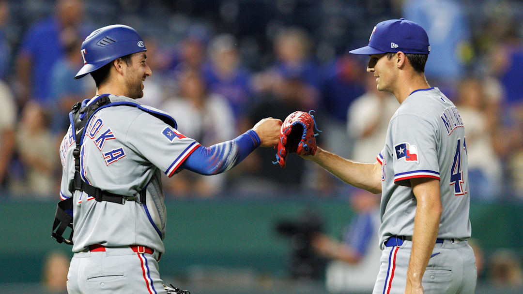 Aug 20, 2025; Kansas City, Missouri, USA; Texas Rangers pitcher Hoby Milner (41) fist bumps Texas Rangers catcher Kyle Higashioka (11) after the game against the Kansas City Royals at Kauffman Stadium. Mandatory Credit: William Purnell-Imagn Images