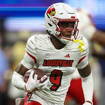 Sep 1, 2023; Atlanta, Georgia, USA; Louisville Cardinals wide receiver Ahmari Huggins-Bruce (9) runs the ball against the Georgia Tech Yellow Jackets in the second quarter at Mercedes-Benz Stadium. 