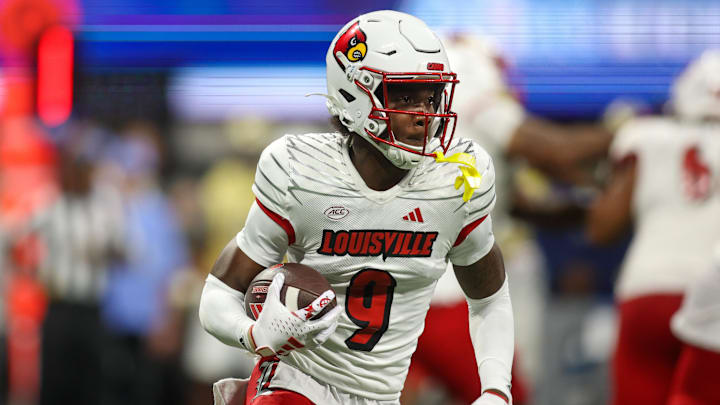 Sep 1, 2023; Atlanta, Georgia, USA; Louisville Cardinals wide receiver Ahmari Huggins-Bruce (9) runs the ball against the Georgia Tech Yellow Jackets in the second quarter at Mercedes-Benz Stadium. 