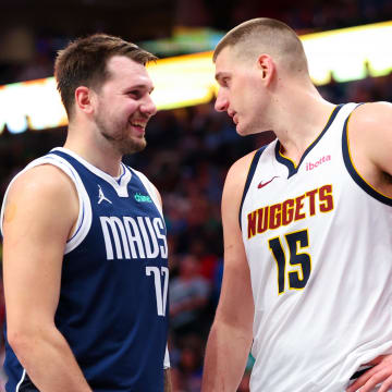 Mar 17, 2024; Dallas, Texas, USA;  Dallas Mavericks guard Luka Doncic (77) speaks with Denver Nuggets center Nikola Jokic (15) during the second half at American Airlines Center. Mandatory Credit: Kevin Jairaj-USA TODAY Sports