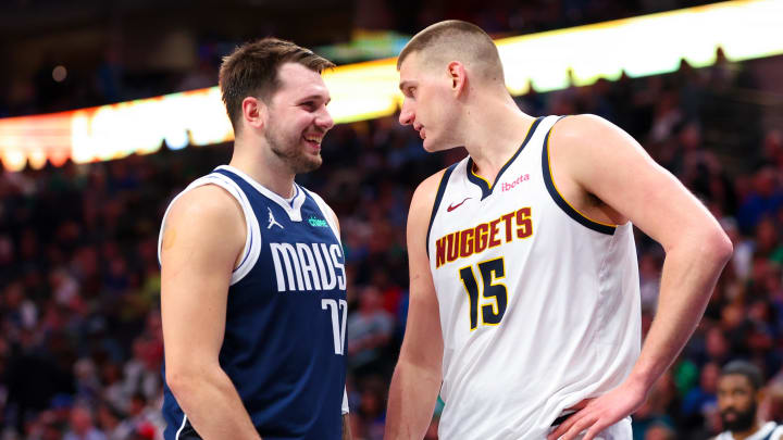 Mar 17, 2024; Dallas, Texas, USA;  Dallas Mavericks guard Luka Doncic (77) speaks with Denver Nuggets center Nikola Jokic (15) during the second half at American Airlines Center. Mandatory Credit: Kevin Jairaj-USA TODAY Sports