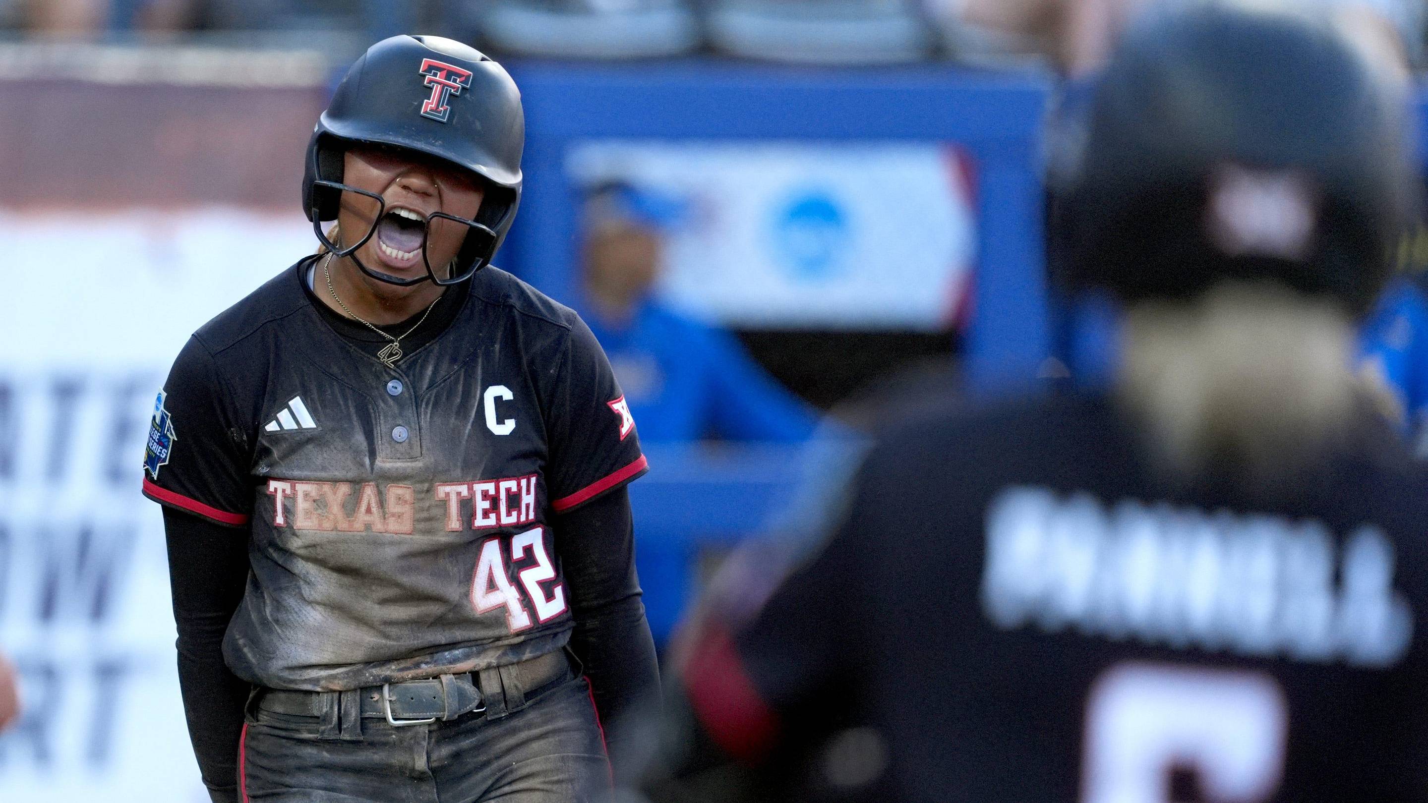 Texas Tech's Mihyia Davis celebrates a score in a Women's College World Series softball game. | SARAH PHIPPS/THE OKLAHOMAN / USA TODAY NETWORK via Imagn Images