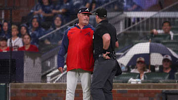 Jun 27, 2025; Atlanta, Georgia, USA; Atlanta Braves manager Brian Snitker (43) talks to umpire Brennan Miller (55) against the Philadelphia Phillies in the second inning at Truist Park. Mandatory Credit: Brett Davis-Imagn Images