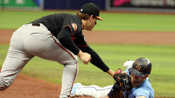 Aug 11, 2024; St. Petersburg, Florida, USA; Baltimore Orioles third base Coby Mayo (16) tags out Tampa Bay Rays designated hitter Brandon Lowe (8) at third base during the third inning at Tropicana Field.