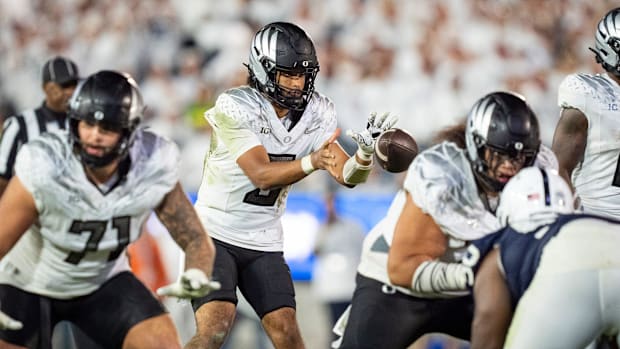 Oregon quarterback Dante Moore takes a snap as the Oregon Ducks face the Penn State Nittany Lions on Sept. 27, 2025, at Beave