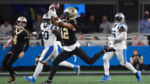 New Orleans Saints wide receiver Chris Olave (12) catches a deep pass against the Carolina Panthers 