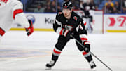 Apr 8, 2025; Buffalo, New York, USA;  Buffalo Sabres defenseman Bowen Byram (4) looks to make a pass during the second period against the Carolina Hurricanes at KeyBank Center. Mandatory Credit: Timothy T. Ludwig-Imagn Images