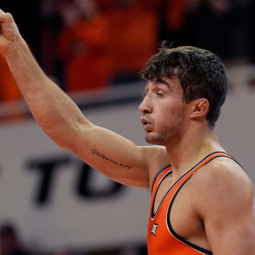 Oklahoma State's Dean Hamiti Jr. celebrates his win over Air Force's Jack Ganos in the 174-pound match during the college wrestling dual between Oklahoma State and Air Force at Gallagher-Iba Arena in Stillwater, Okla., Friday, Jan., 3, 2025.