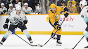 Mar 6, 2025; Nashville, Tennessee, USA;  Nashville Predators right wing Ozzy Wiesblatt (89) takes a shot on goal against the Seattle Kraken during the first period at Bridgestone Arena. Mandatory Credit: Steve Roberts-Imagn Images