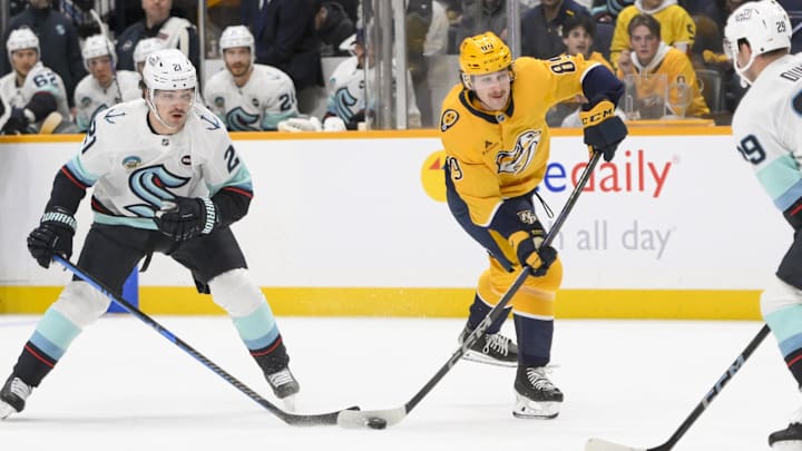 Mar 6, 2025; Nashville, Tennessee, USA;  Nashville Predators right wing Ozzy Wiesblatt (89) takes a shot on goal against the Seattle Kraken during the first period at Bridgestone Arena. Mandatory Credit: Steve Roberts-Imagn Images