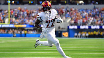 Oct 5, 2025; Inglewood, California, USA; Washington Commanders running back Jacory Croskey-Merritt (22) runs for a touchdown against the Los Angeles Chargers in the second half at SoFi Stadium. Mandatory Credit: Gary A. Vasquez-Imagn Images