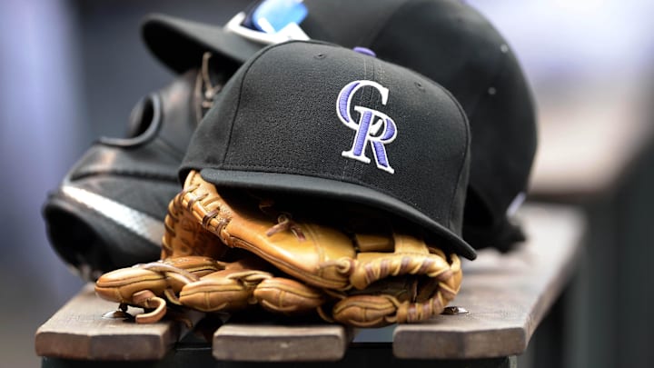 Apr 10, 2015; Denver, CO, USA; General view of Colorado Rockies hats and gloves during the eighth inning against the Chicago Cubs at Coors Field. 