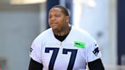 Jul 26, 2023; Foxborough, MA, USA; New England Patriots offensive tackle Trent Brown (77) makes his way to the practice fields for  training camp at Gillette Stadium. Mandatory Credit: Eric Canha-Imagn Images