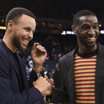 April 7, 2018; Oakland, CA, USA; Golden State Warriors guard Stephen Curry (30, left) shakes hands with New Orleans Pelicans guard Ian Clark (2, right) after the game at Oracle Arena. The Pelicans defeated the Warriors 126-120. Mandatory Credit: Kyle Terada-USA TODAY Sports