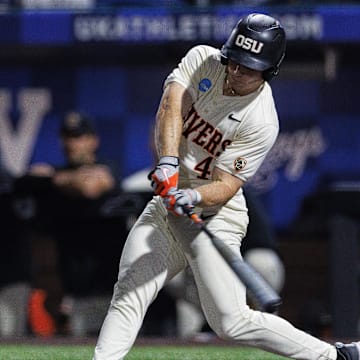 Jun 9, 2024; Lexington, KY, USA; Oregon State Beavers infielder Dallas Macias (4) hits a pitch during the fourth inning against the Kentucky Wildcats at Kentucky Proud Park. Mandatory Credit: Jordan Prather-Imagn Images