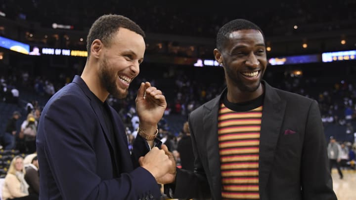 April 7, 2018; Oakland, CA, USA; Golden State Warriors guard Stephen Curry (30, left) shakes hands with New Orleans Pelicans guard Ian Clark (2, right) after the game at Oracle Arena. The Pelicans defeated the Warriors 126-120. Mandatory Credit: Kyle Terada-USA TODAY Sports