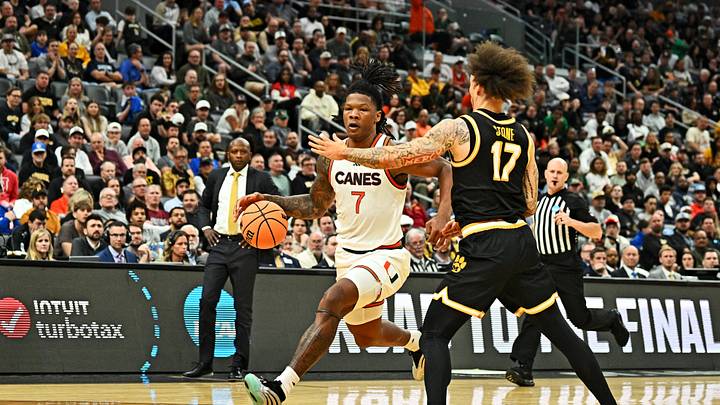 Mar 20, 2026; St. Louis, MO, USA; Miami (FL) Hurricanes forward Shelton Henderson (7) drives to the basket as Missouri Tigers guard Jayden Stone (17) defends during the second half during a first round game of the men's 2026 NCAA Tournament at Enterprise Center. Mandatory Credit: Jeff Le-Imagn Images