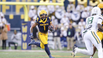 Nov 16, 2024; Morgantown, West Virginia, USA; West Virginia Mountaineers running back Jahiem White (1) runs the ball during the first quarter against the Baylor Bears at Mountaineer Field at Milan Puskar Stadium. Mandatory Credit: Ben Queen-Imagn Images