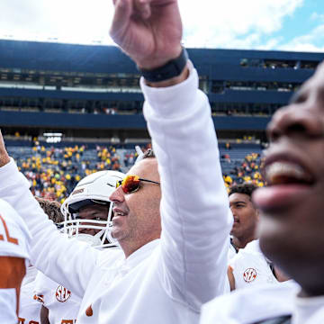 Sep 7, 2024; Ann Arbor, Michigan, USA; Texas head coach Steve Sarkisian and Texas players celebrate their win over Michigan at Michigan Stadium. Mandatory Credit: Junfu Han-USA TODAY Network via Imagn Images